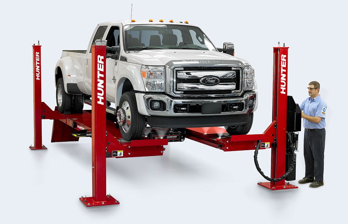 four post lift with truck and technician