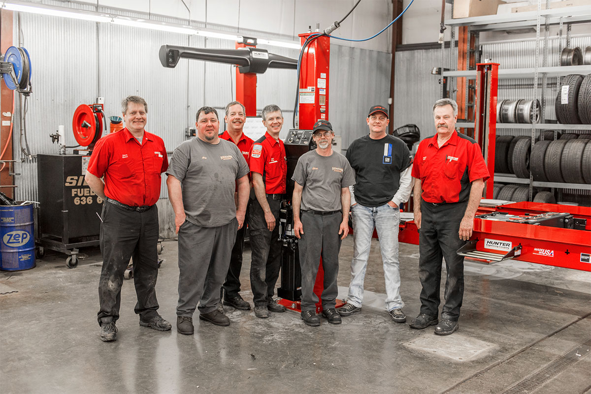 rack-l45x-install-hemannautomotive7.jpg service reps and customer smiling and standing by alignment system