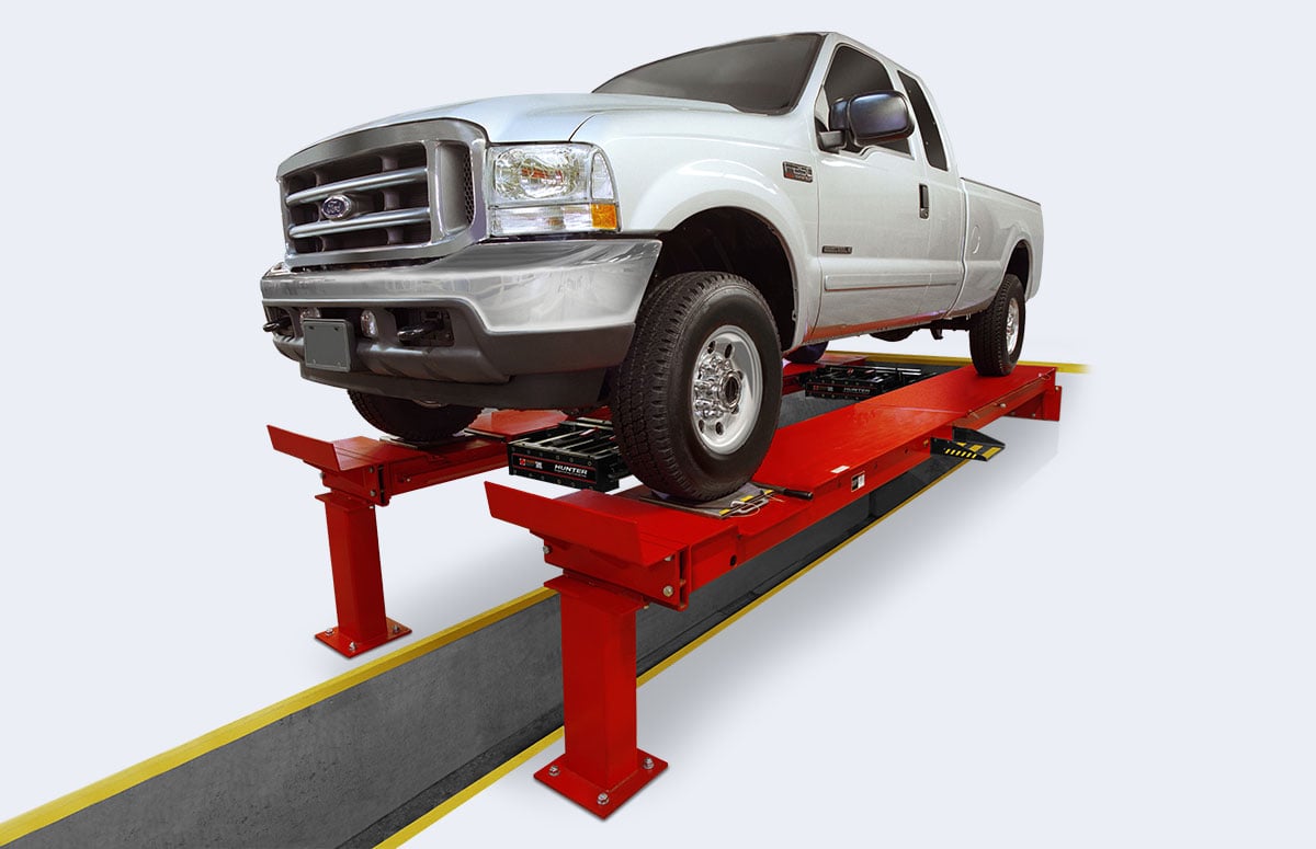 white truck on red pit rack